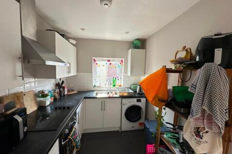 A bright and functional kitchen featuring moder...
