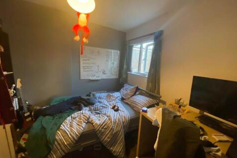 A cozy double bedroom with good natural light a...