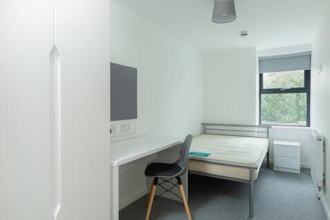 A bright and tidy double bedroom featuring a sp...