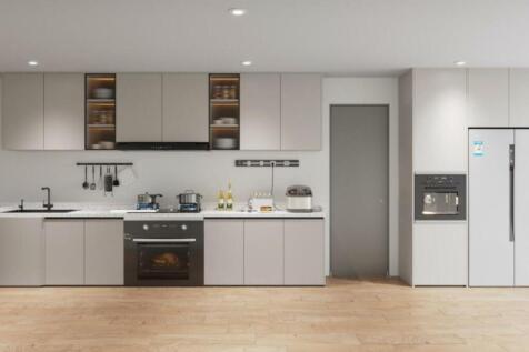 A modern and spacious kitchen equipped with sty...