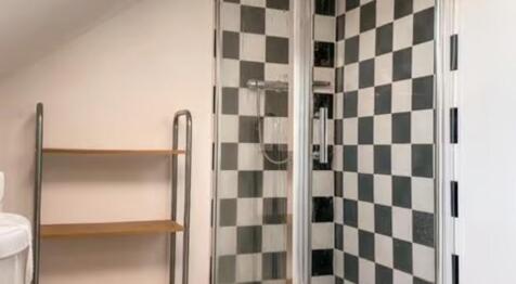 A modern bathroom featuring a stylish black and...