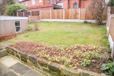 This charming garden space offers a serene outd...