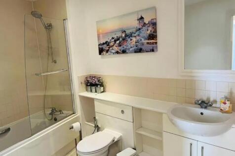 Bright and clean bathroom featuring a modern ba...