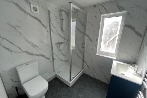 A modern and clean bathroom featuring a stylish...