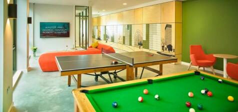A stylish and spacious recreational room featur...