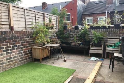 A charming and well-maintained garden space fea...
