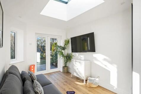 A bright and spacious modern living room with l...