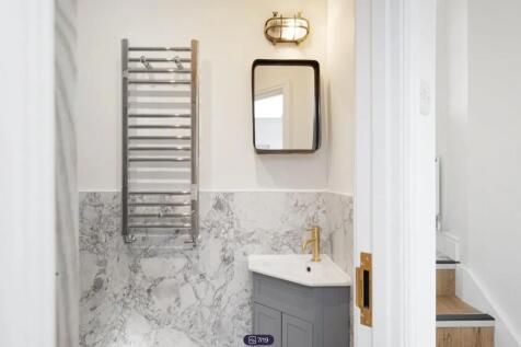 A beautifully designed bathroom featuring elega...