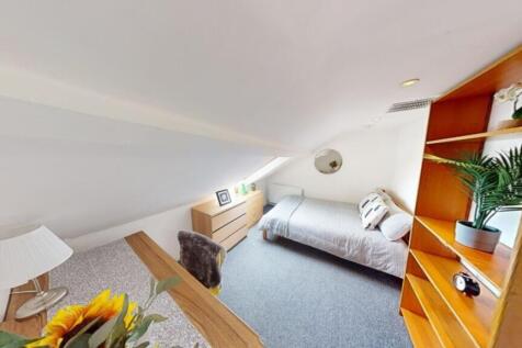 A bright and inviting double bedroom featuring ...