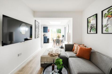 A stylish and spacious modern living room, perf...