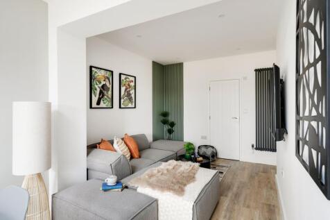 A stylish and spacious modern living room, perf...
