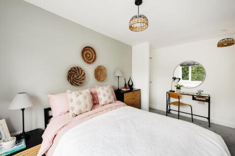A beautifully designed double bedroom with exce...