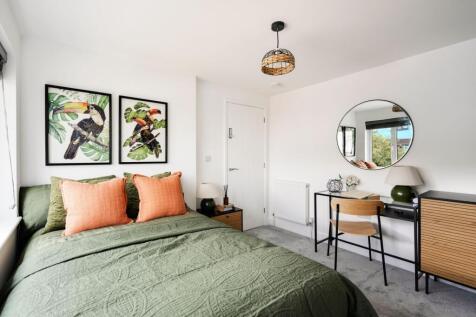 A stylish and inviting double bedroom featuring...
