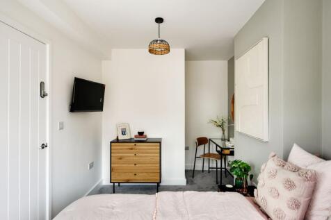 A stylish and inviting double bedroom featuring...