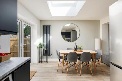 A bright and spacious kitchen featuring modern ...
