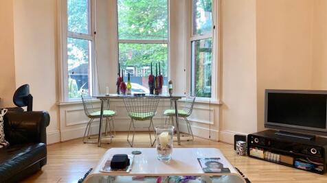 A bright and inviting living room featuring a l...