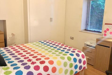 Bright and cozy double bedroom featuring a colo...