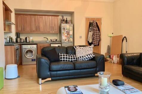 A cozy and functional living room featuring mod...