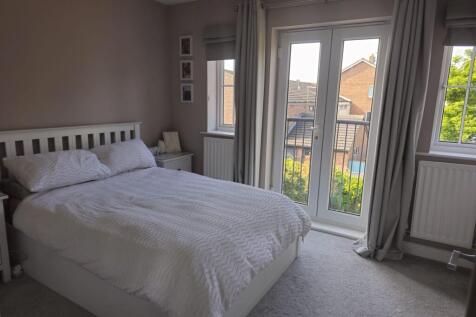 Bright and inviting master bedroom featuring a ...