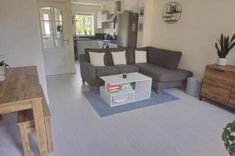 Bright and welcoming living room featuring a co...