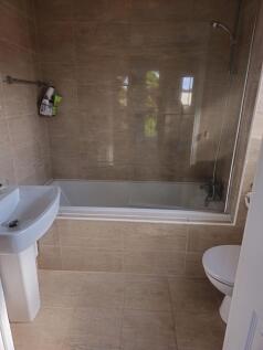 A modern, well-maintained bathroom suite featur...