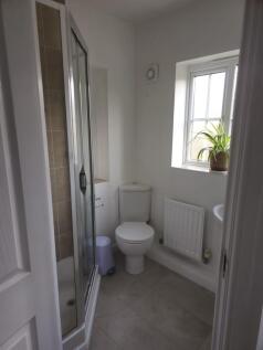 A clean and well-maintained bathroom featuring ...