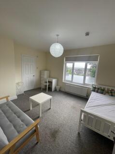 Bright and airy double bedroom featuring a larg...