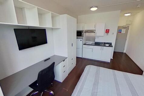 A modern and well-organized master bedroom feat...
