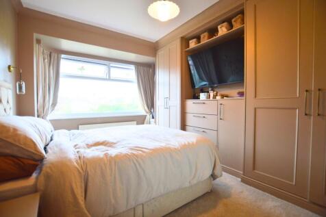 Bright and inviting master bedroom featuring a ...