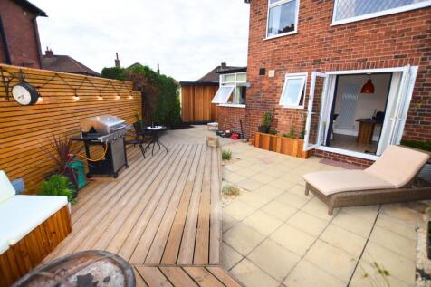 A well-maintained and inviting garden space fea...