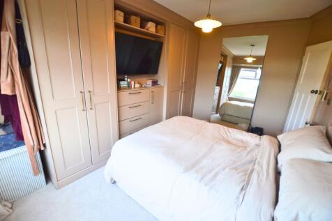 Bright and cozy double bedroom featuring a comf...