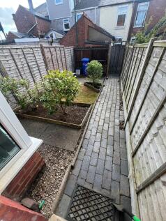 A neat and well-maintained garden space with a ...