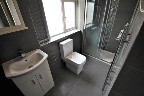 Modern bathroom featuring a clean design with a...