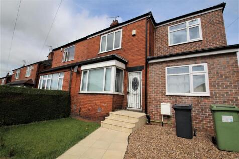 A well-maintained red brick terraced house feat...