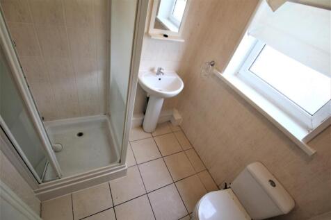 Bright and functional bathroom featuring a show...