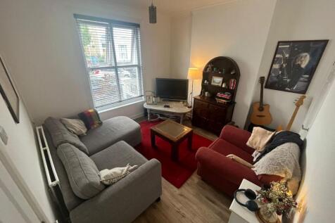 A cozy living room featuring comfortable seatin...