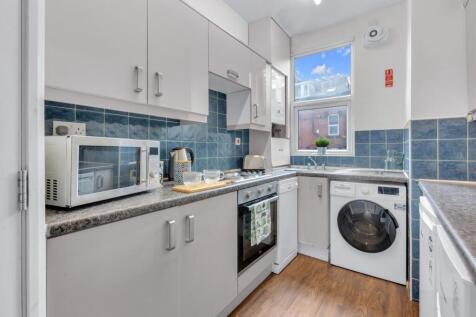 Bright and well-maintained kitchen featuring mo...