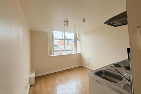 Bright kitchen area featuring a large window th...