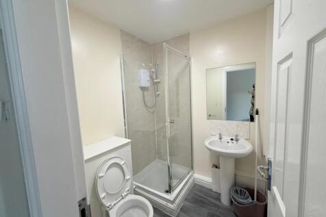 A clean and functional bathroom featuring a cor...