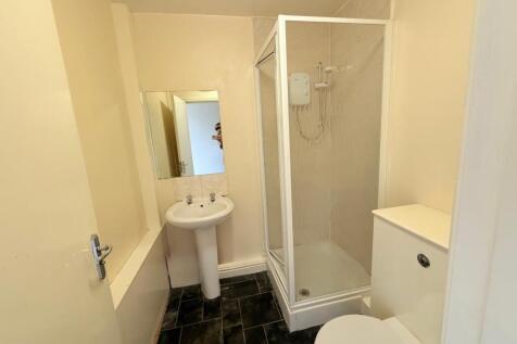 A clean and functional bathroom featuring a cor...
