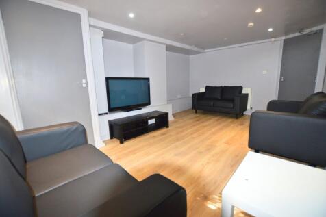 A modern living room featuring clean wooden flo...