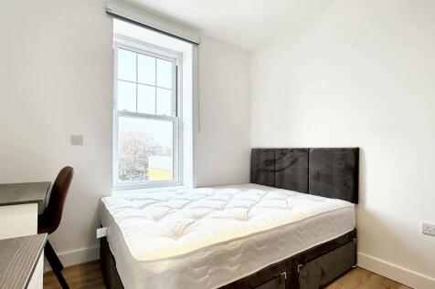 Bright and inviting double bedroom featuring a ...