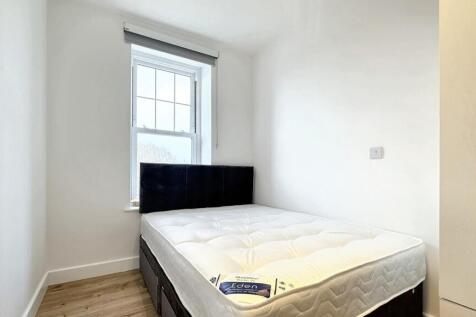 Bright and cozy double bedroom featuring a comf...