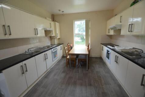 Bright and spacious kitchen with dual worktops,...