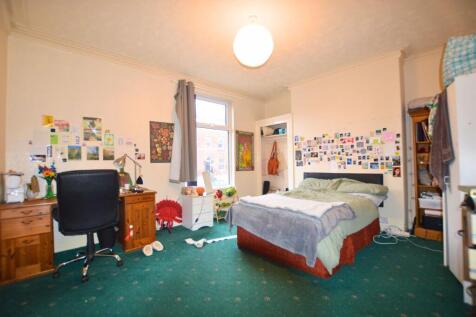 Bright and cozy double bedroom featuring a comf...