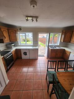 Bright and spacious kitchen featuring terracott...