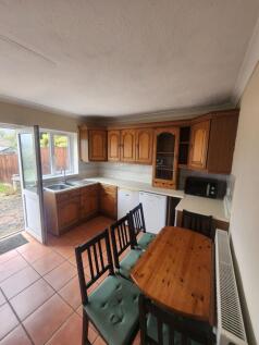Bright and welcoming kitchen featuring classic ...