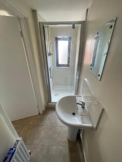 A tidy and functional bathroom featuring a mode...