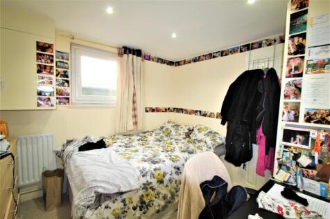 Cozy double bedroom featuring a bright window, ...