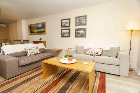 A welcoming living room featuring two comfortab...
